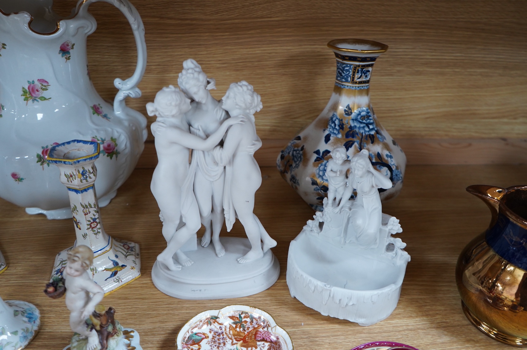 A bisque figure group of the Three Graces - 27cm high, a smaller smaller bisque figure, a pair of Vienna style coffee cans and saucers and a collection of mixed floral china. (22)